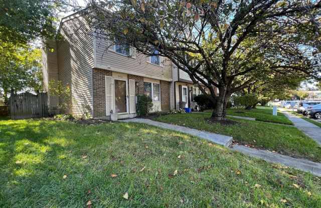 Welcome to this chic 3 bedroom end of group townhome in Queen Anne Village. Gallery 1