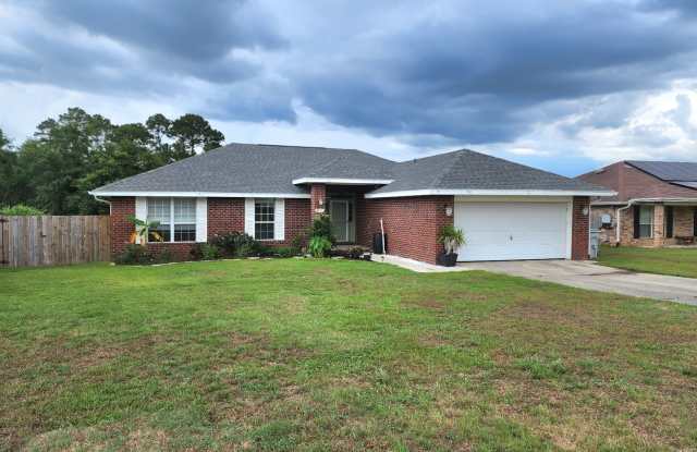 Adorably Styled and Updated 4 bedroom 2 bath Brick home located in Pace Community of La Floresta! Gallery 3