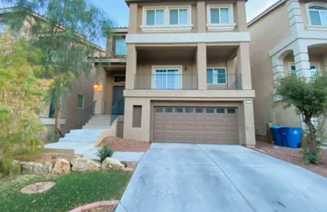 Gorgeous three story home with open floor plan, stainless steel appliances, huge granite countertop island, carpet flooring across the entire home with tile and a balcony. - 6719 Bel Canto Court, Enterprise, NV 89139 Gorgeous three story home with open floor plan, stainless steel appliances, huge granite countertop island, carpet flooring across the entire home with tile and a balcony. - 6719 Bel Canto Court, Enterprise, NV 89139