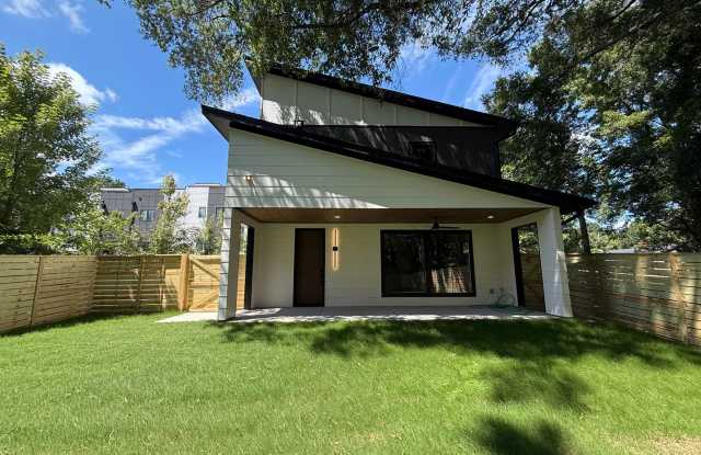 **OFFERING $1,500 MOVE-IN CREDIT & REFUNDABLE APPLICATION FEES** Newly Built Luxury 3BD, 2.5BA Downtown Raleigh Home with a Private Fenced Yard, No Shared Walls & a 2-Car Attached Garage Gallery 1