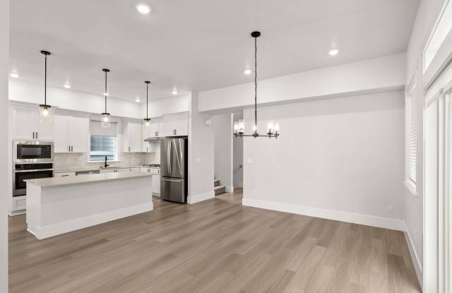 Welcome to Modern Living in this beautifully designed 4-bedroom, 2.5 bath home! Gallery 4