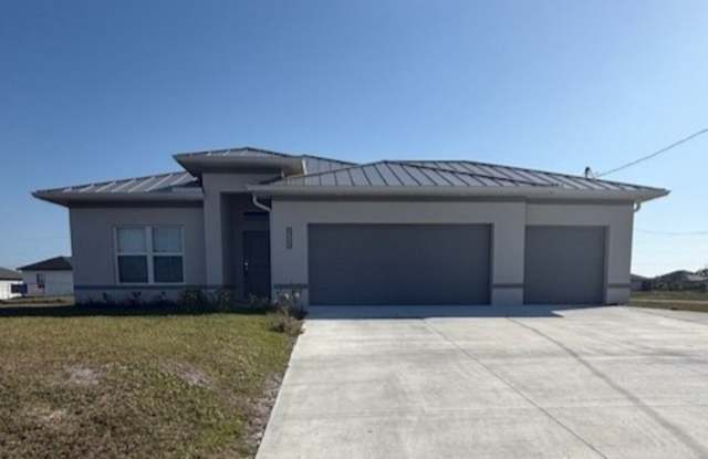 Like-New Cape Coral Home with 3-Car Garage, Fenced Yard & Modern Upgrades! photos photos