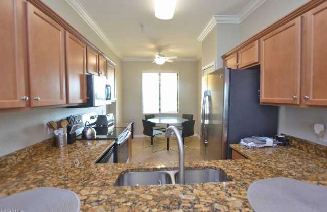 Golfer's Paradise - this Penthouse Floor 2/2 waterfront\golf course view has golf transfer membership! -- AVAILABLE JAN-MARCH 2027 ** and LONGER TERM MAY-NOVEMBER 2026 ONLY ** photos photos