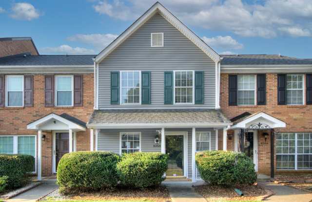 Discover this beautifully updated Raintree townhome featuring an open floor plan and a range of contemporary enhancements. - 8268 Golf Ridge Drive, Charlotte, NC 28277