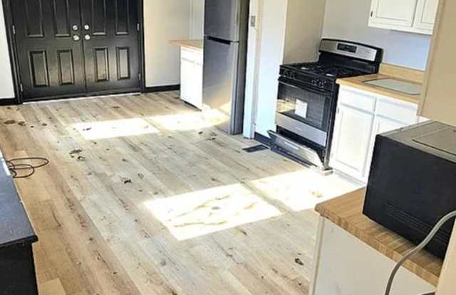 Spacious 4-Bedroom Home with 3-Car Garage, Deck  More!! photos photos