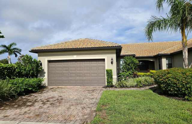 Stunning Model Home – 2 Bedrooms plus Den, 2 Bath located in Island Walk! photos photos
