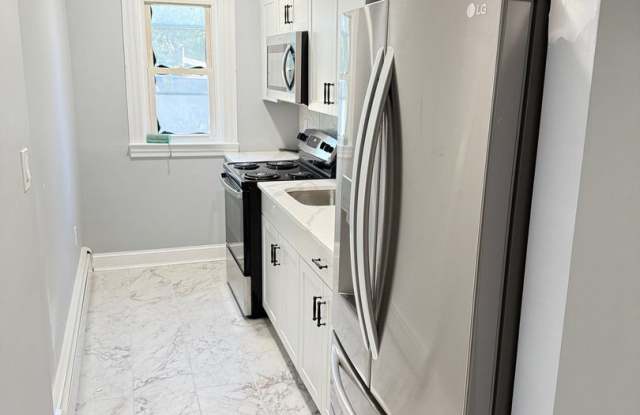Charming 3BR Duplex in Manchester Gallery 1