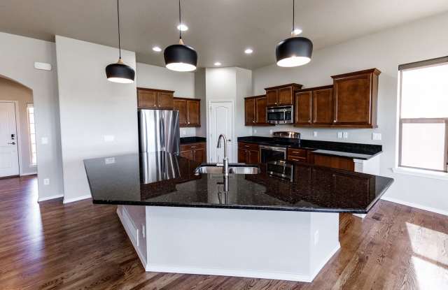 Luxury Golf Course Ranch Walkout in Flying Horse | Stunning AFA & Mountain Views Gallery 3
