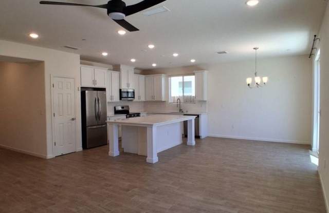 SPECIAL: HALF OF FIRST MONTH'S RENT! Solar Included! Spacious Single-Story Fresno Home with Den & 2-Car Garage! photos photos