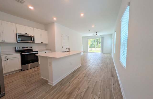 NOW LEASING - NEW 2026 VILLA CONSTRUCTION!! 3/2.5/1 with premium finishes in the a new development community of in Hansen Creek - conveniently located just off I-295 and Lem Turner. Gallery 4