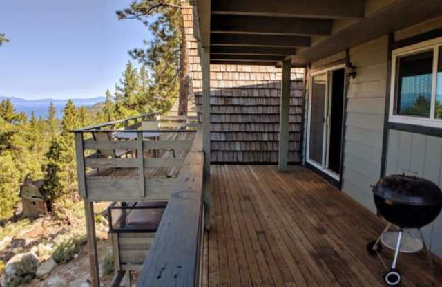 "Million Dollar Views" This home offers breath-taking views of majestic Lake Tahoe, a spacious home perched on the mountain side surrounded by large enchanted Pines; this is the home for you! photos photos