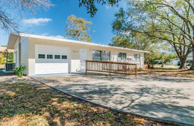 Beautifully updated 3/2/1 1389 Sq. Ft. with UPDATED kitchen  baths with GRANITE, large open living room, custom tile work and a storage shed!! - 4201 63rd Street North, St. Petersburg, FL 33709