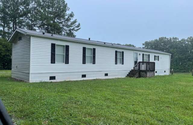 2 BDRM 2 BATH MOBILE HOME LOCATED IN THE COUNTRY. HEAT PUMP CENTRAL AIR. STOVE REF DW. WASHER  DRYER INCLUDED. LVT FLOORING THROUGHOUT. REMC  WELL. NO PETS ALLOWED. $1,000 MONTH, $1,000 DEPOSIT - 7120 Gravel Hill Road, Randolph County, NC 27239