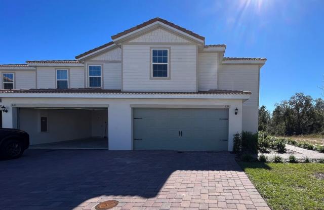 Modern 3-Bedroom Townhome in Gated Poinciana with Included Utilities! photos photos