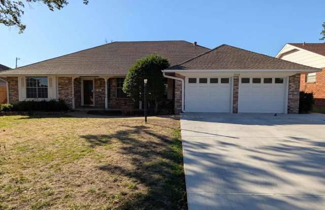 Beautiful Brick Home with Inviting Living Spaces & Sunroom Gallery 1