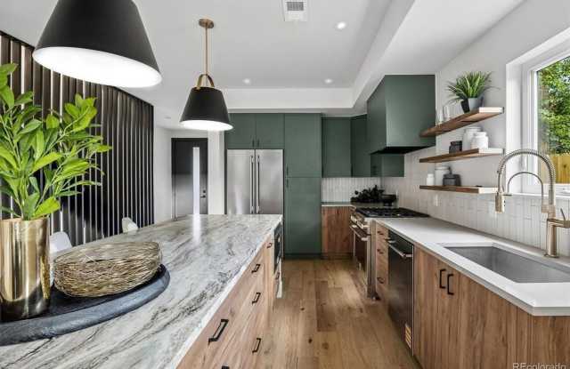 Brand-New Modern 4BR Home with Rooftop Deck & Mountain Views in Overland Gallery 3