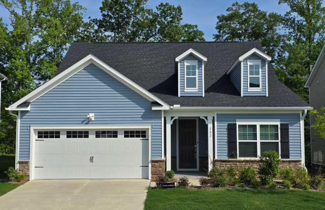 4 spacious bedrooms and 3 full bathrooms along with guest suite. 1st floor primary and secondary bedrooms. Includes security system - 202 Trailing Bluff Way, Wake County, NC 27529