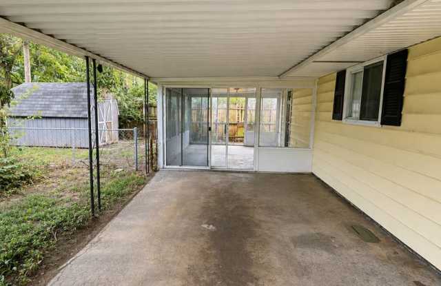 Charming 2BR Home with Enclosed Porch, Carport & Storage Shed Gallery 3