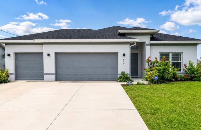 Modern Cape Coral Home with 3-Car Garage, Designer Upgrades & Flexible 4-Bedroom Layout! photos photos