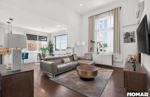 Bright South-Facing 2BR/2BA Condo | High Ceilings | NYC Views | 2 Garage Spaces photos photos