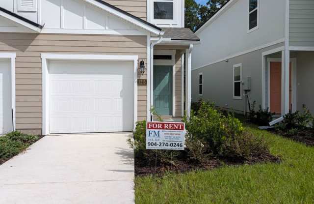 NOW LEASING - NEW 2026 VILLA CONSTRUCTION!! 3/2.5/1 with premium finishes in the a new development community of in Hansen Creek - conveniently located just off I-295 and Lem Turner Gallery 4