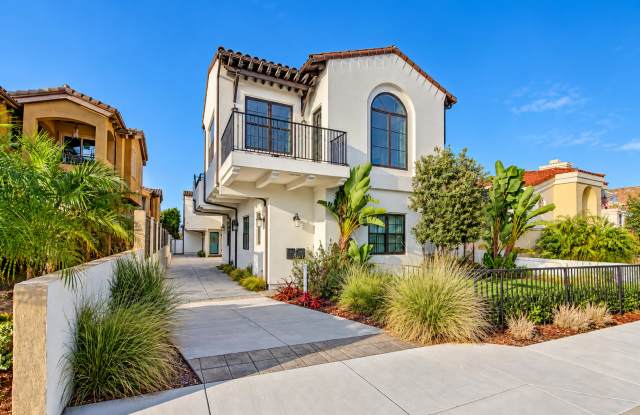 Upscale & Spacious, Spanish Style Tri-Level Townhome w/ Amazing Great Room Living Space, Rooftop Deck, 2 Balconies, Rear Yard & 2-Car Garage Close to Schools, Shopping & Just 2 Blocks to MB Border & 5 Mins to Beach! Gallery 1