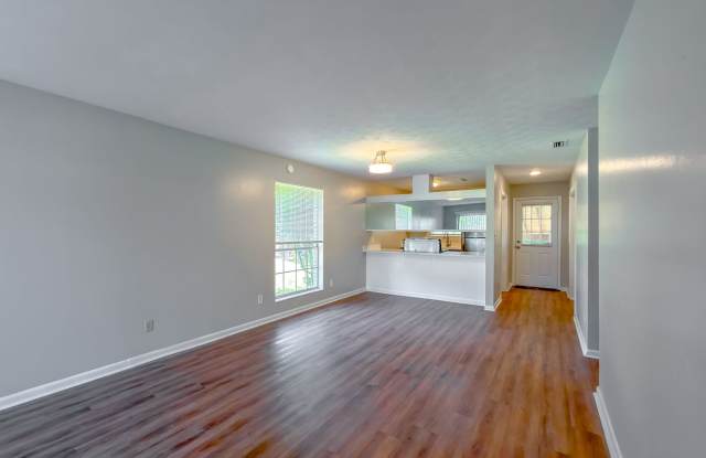 RENOVATED 2/1 w/ New Flooring/Paint, Fenced Yard, Deck, Walk In Closets, Granite Counters, & Stainless Appliances ! Avail NOW for $1275/month Gallery 1