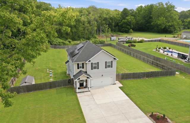 Newer Home On 3 Acres! Landscaping, Electric, Water, & Sewer Included In Price! Pet Friendly - Attached Garage w/Opener - Storage Shed! Gallery 1