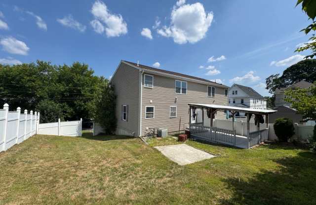 Recently Updated 3-Bedroom Townhouse in Lawrence, MA photos photos