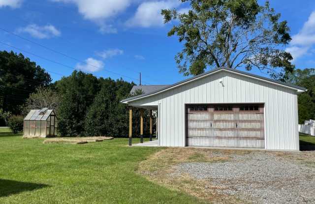 Farm house charm! A great home with a country feel and a spcious yard to enjoy. Gallery 3