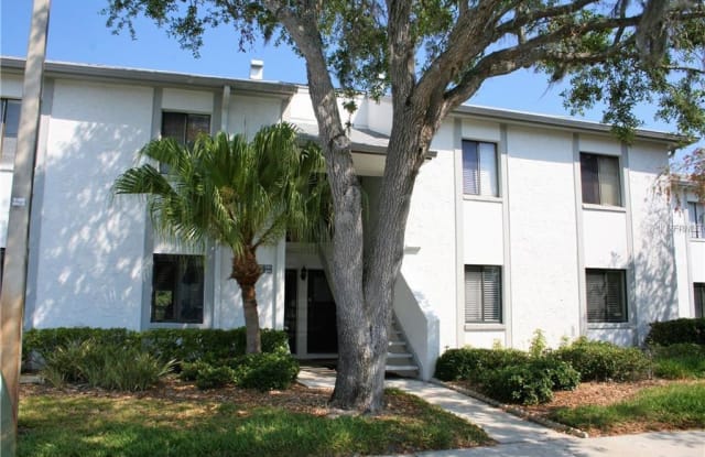 128 E CYPRESS COURT - 128 East Cypress Court, East Lake, FL 34677