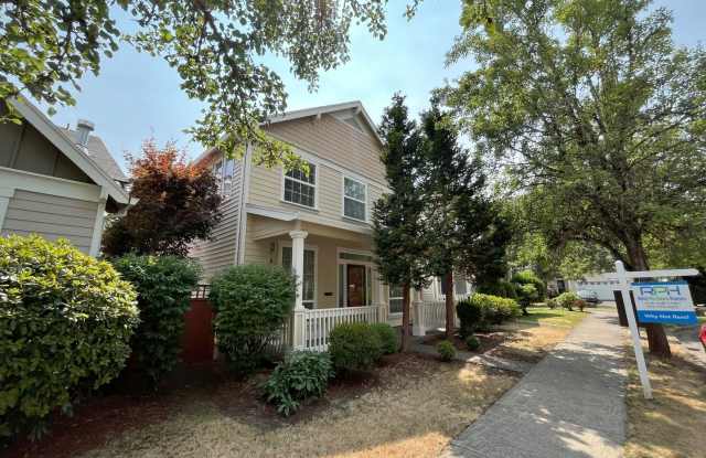 Inviting 4-Bedroom, 3-Bathroom Home with Vaulted Ceilings, Double-Sided Fireplace  Serene Outdoor Space - 5596 Northeast Canard Drive, Hillsboro, OR 97124