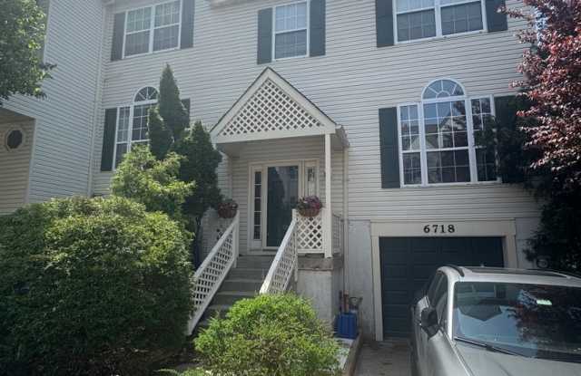 Stunning 3–4 Bedroom Townhome in Private Community | Garage + EV Charger | Deck with Tree Views photos photos