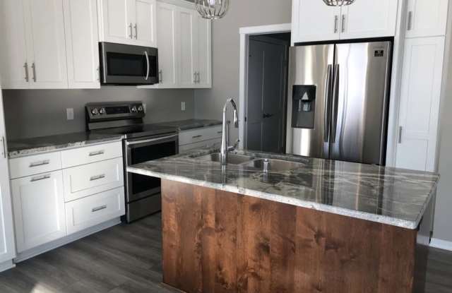 Bring In the New Year January 2026 with this beautifully maintained 4-bedroom, 2-bath, two car attached garage! photos photos