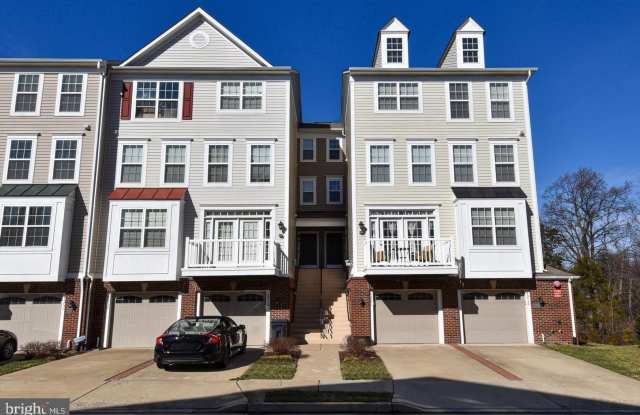 Bright and stylish four level garage townhouse nestled in a peaceful neighborhood setting. photos photos