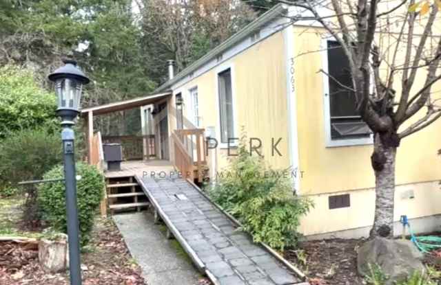 Cozy Oak Bay Retreat: Bright 1 Bedroom With Wood Stove and Private Deck photos photos