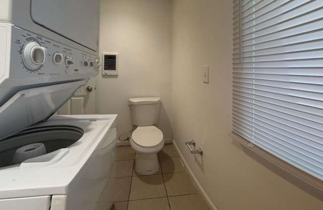 Charming 4BR/2BA Rowhouse with Hardwood-Style Flooring Throughout photos photos