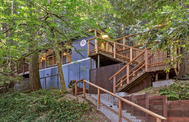 Fully furnished hillside 2 bedroom., 2 bath home among Redwood and Pine Trees, large covered porch, modern interior, deck photos photos