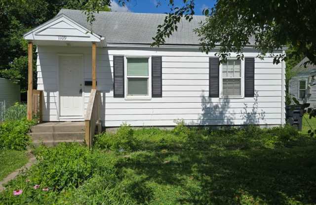 2 bd, 1 ba house, hardwoods, new paint, fenced with shed, w/d included, mowing provided, north central location near Business Loop photos photos