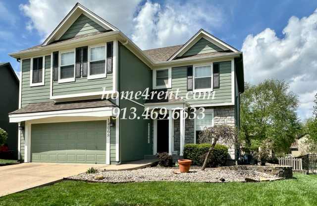 Updated Kitchen, Large Two Tiered Deck, Finished Basement in Blue Valley Schools! photos photos