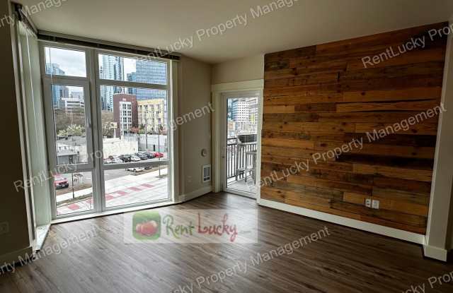 GREAT NEW PRICE! Gorgeous 1 Bedroom + 2 Baths + Den w/Secured Parking Spot in Prime Seattle Location! Gallery 4