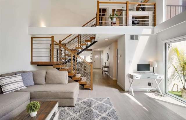 Spacious 1,550 Sq Ft Townhome | 2-Car Garage  High Ceilings w/ Exposed Beams photos photos