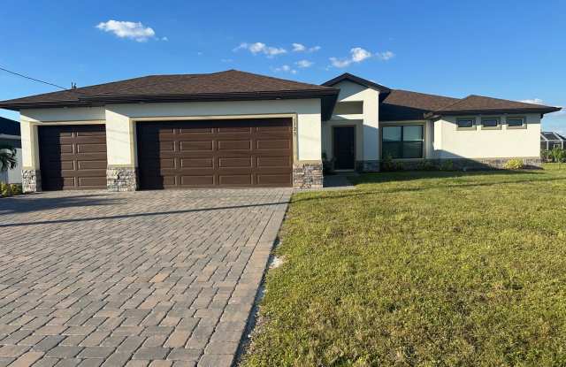 4 Bedroom 2 Bathroom 3 Car Garage- NW Cape Coral Home with Screened Lania -AVAILABLE NOW - 1723 Northwest 20th Street, Cape Coral, FL 33993