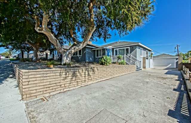 Updated, Bright & Airy 3BR2BA Home + Detached Bonus Room on Spacious Lot w/ Large Front Yard, Huge Rear Yard, Detached Garage w/ Bonus Room & Large Driveway Close to Schools, Shopping, Restaurants, Easy Freeway Acces & 5 Mins to Beach! Gallery 1