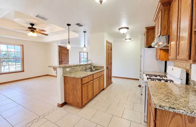 5BR/4BA Alton Home with Vaulted Ceilings, Granite Kitchen & Garage — $1,950/mo Gallery 3