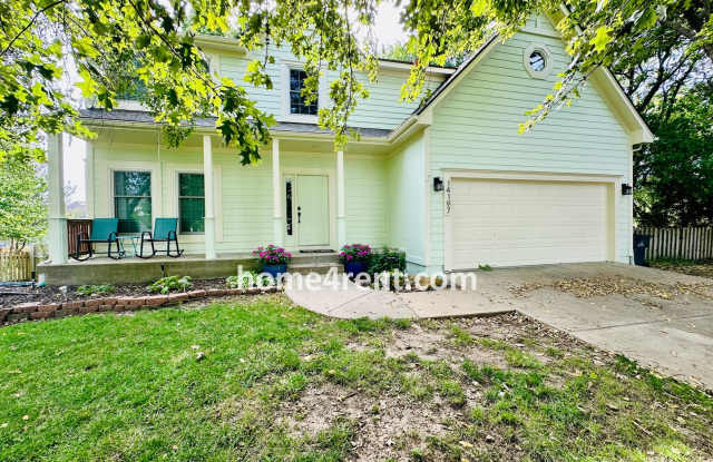 Blue Valley Schools w/ Wood Floors, Finished Basement and a Peaceful, Private Fenced Yard! photos photos
