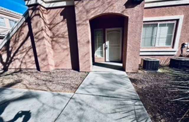 Cozy 1st-floor condo unit with 2 bedrooms and 2 bathrooms. Located in a guard-gated community in Summerlin. photos photos