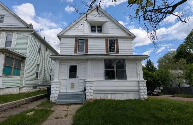 Spacious 5-bedroom, 1-bath home offers flexible living across multiple levels in Akron photos photos