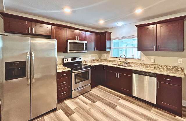 NEWLY RENOVATED CANAL-FRONT HOME ON DOUBLE LOT WITH BOAT LIFTS & MANGO TREES! Gallery 4