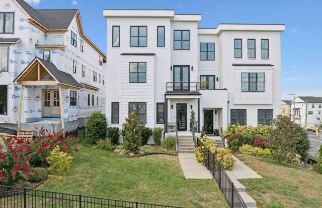 Experience elevated living in this beautifully crafted brick residence located in the heart of Edgehill photos photos